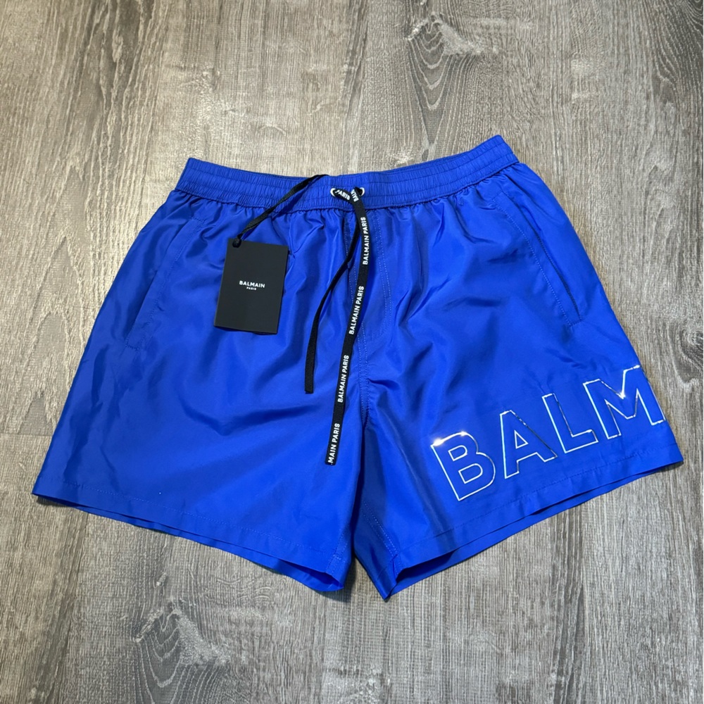 BALMAIN**Blue Embossed Logo Men’s Swim Shorts**Med. $689